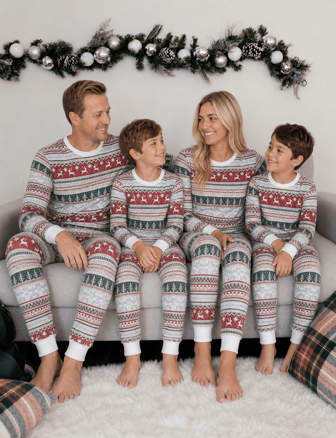 Family wearing matching Fair Isle reindeer print Christmas pajamas with white cuffs - view 5