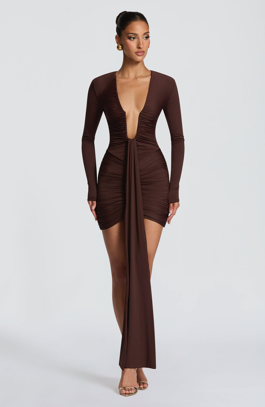 Ruched brown long sleeve bodycon mini dress with deep plunge and ankle-length drape