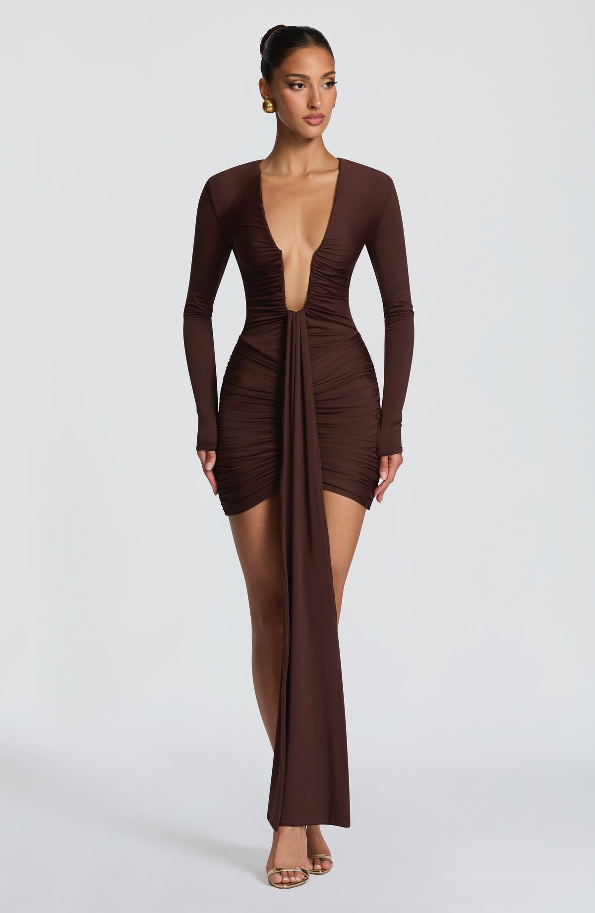 Ruched brown long sleeve bodycon mini dress with deep plunge and ankle-length drape