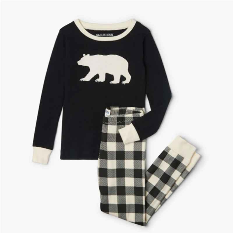 Matching holiday pajamas with checked plaid pants and dark long-sleeve tops - view 6