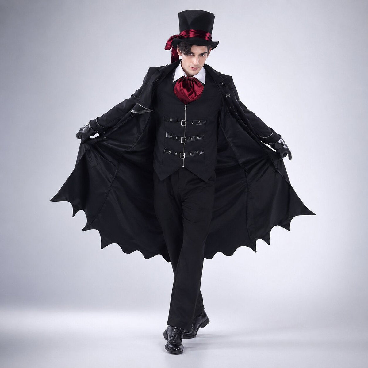 Black vampire Halloween costume with long bat-wing hem coat, buckled vest and red cravat - view 2