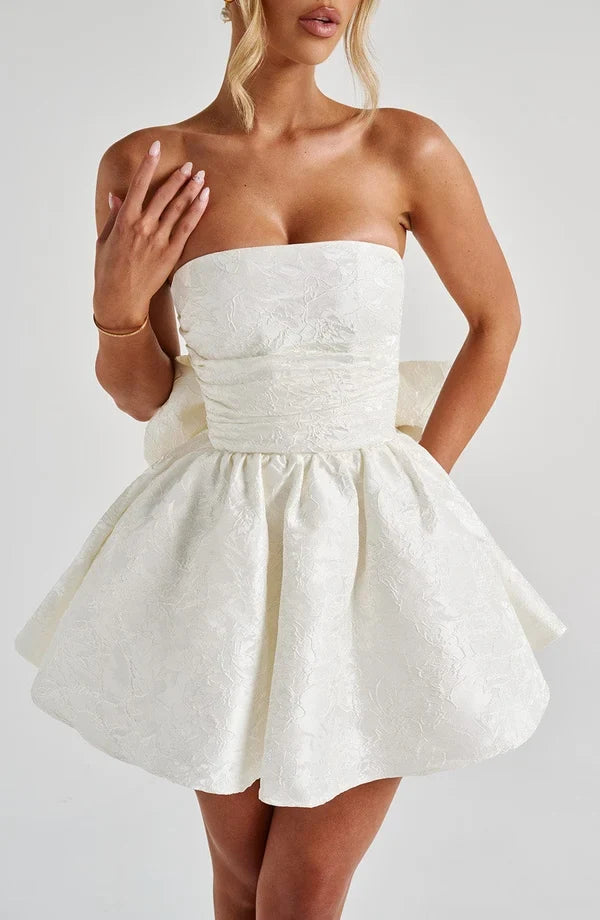 Pink jacquard homecoming mini dress with strapless bodice, corset lacing and large back bow - view 10