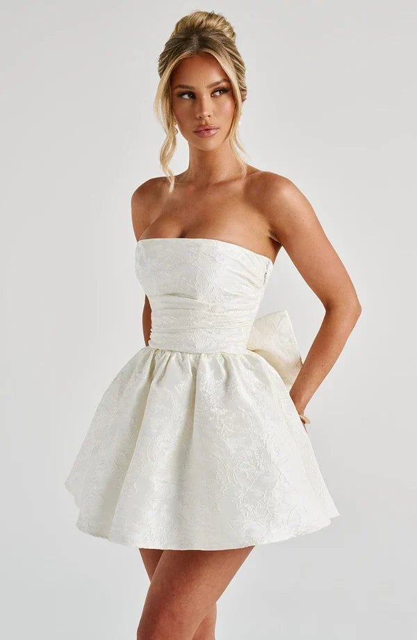 Pink jacquard homecoming mini dress with strapless bodice, corset lacing and large back bow - view 11