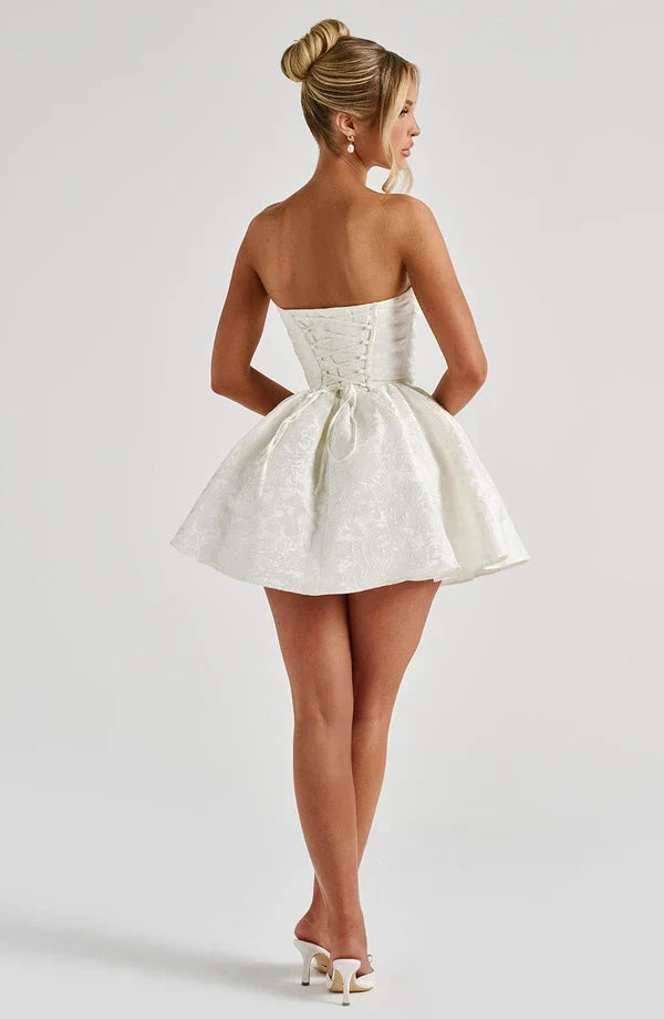 Pink jacquard homecoming mini dress with strapless bodice, corset lacing and large back bow - view 12