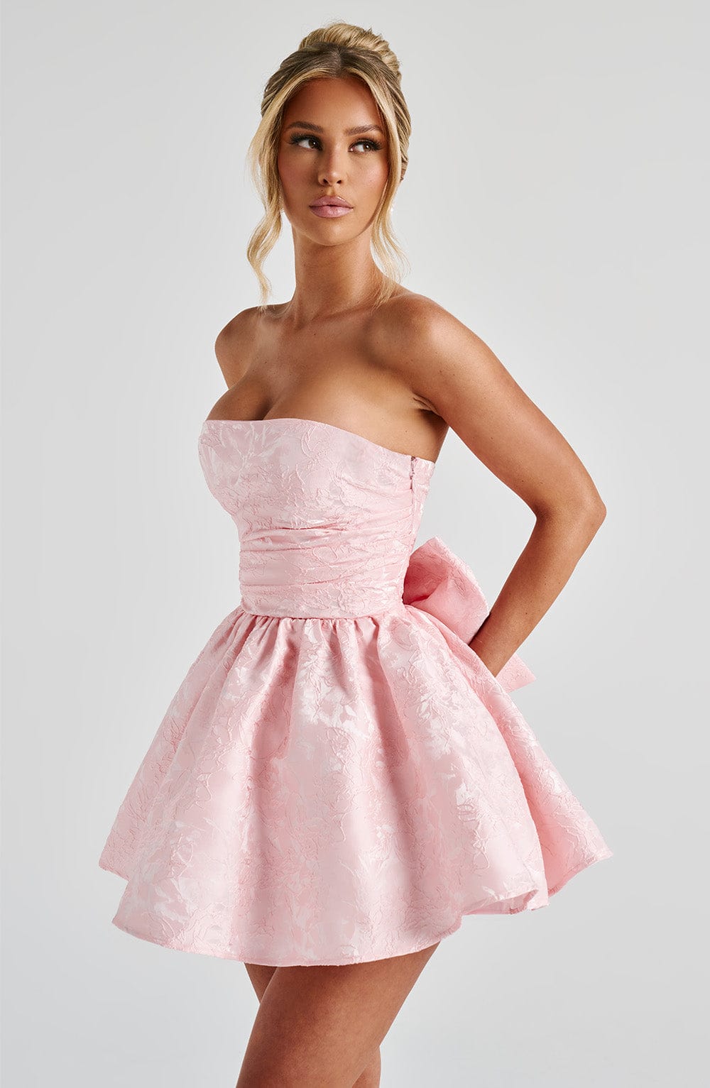 Pink jacquard homecoming mini dress with strapless bodice, corset lacing and large back bow - view 5