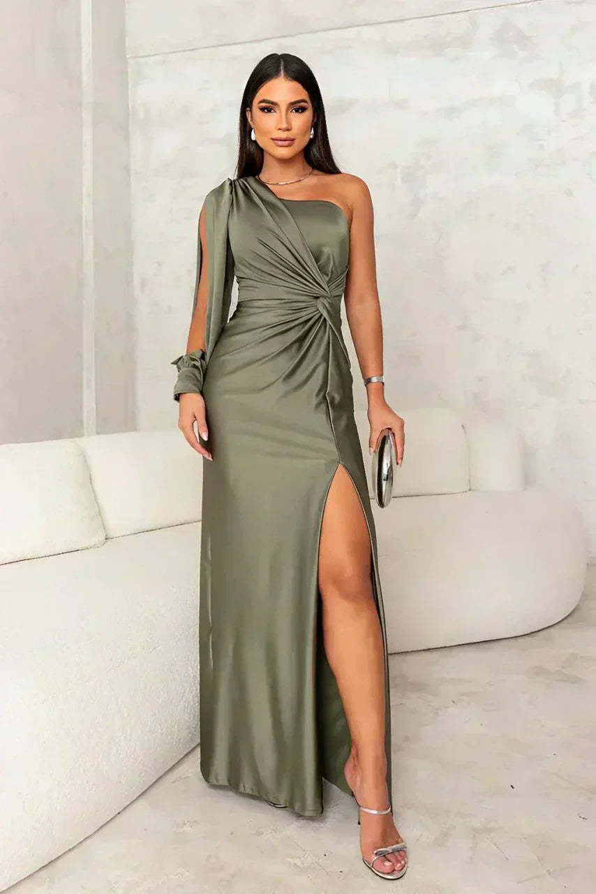 Woman wearing a satin one shoulder long sleeve formal maxi dress with twist-knot waist and thigh slit - view 2