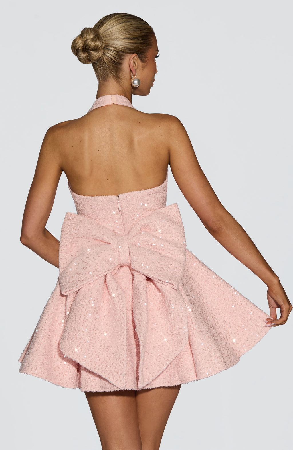 Sparkly pink halter mini dress with flared skirt and back bow - view 2