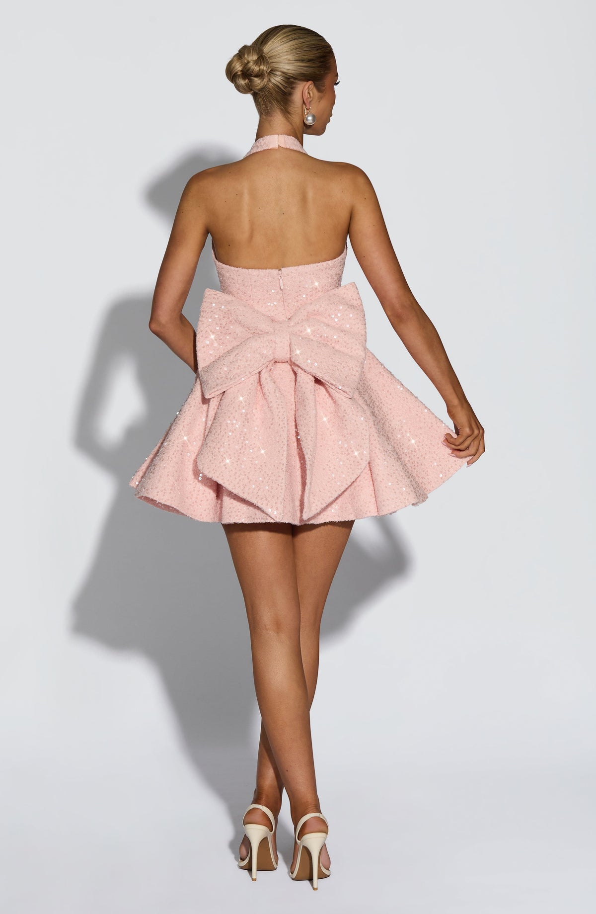 Sparkly pink halter mini dress with flared skirt and back bow - view 6
