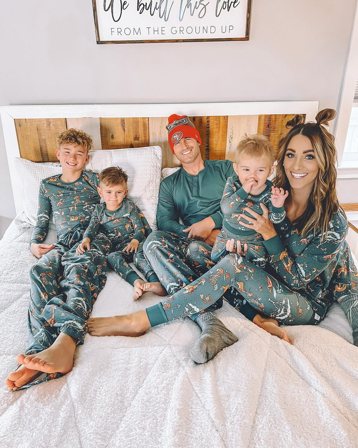 Matching family Christmas pajamas in green with festive safari animal print - view 11