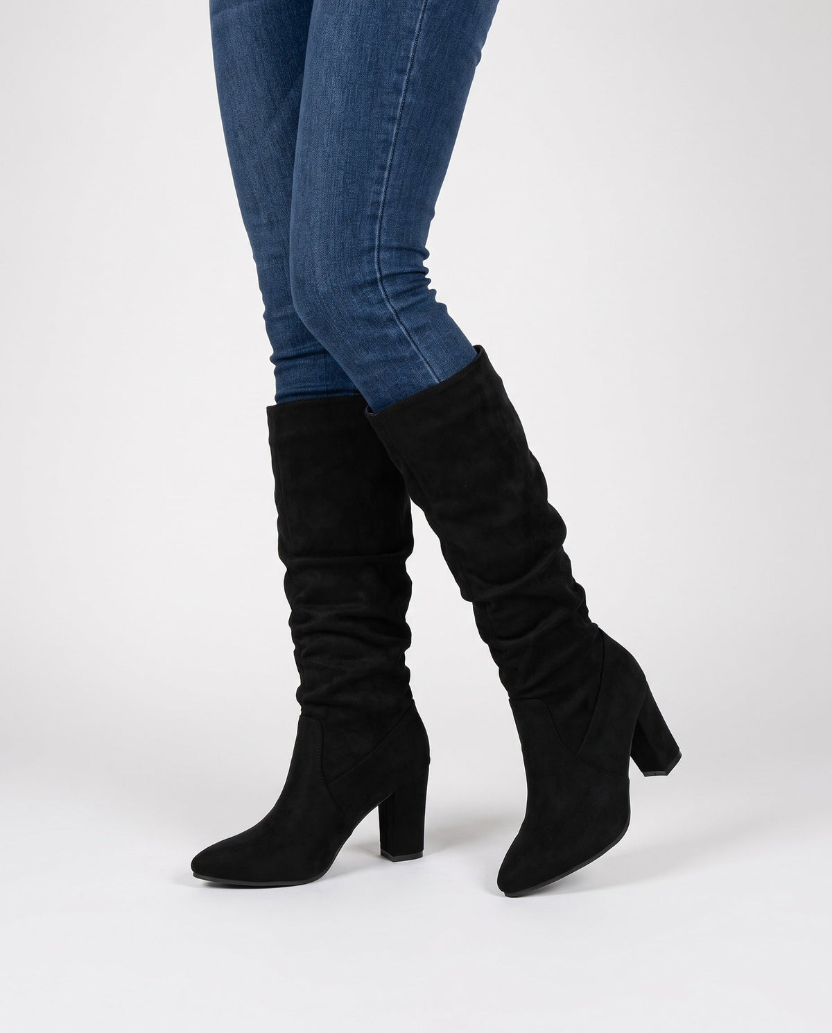Black faux suede slouchy knee high boots with pointed toe and block heel