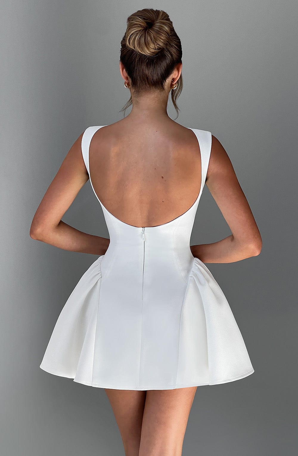 Elegant fitted mini dress with boat neck, low scoop back and full skirt - view 4